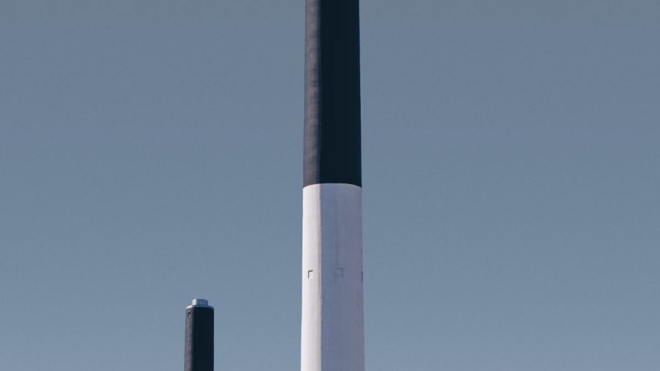 Vertical shot of chimneys of a factory in Frederiskberg in Copenhagen, Denmark Vertical shot of chimneys of a factory in Frederiskberg in Copenhagen, Denmark